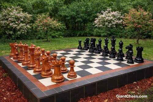 Giant teak chess set photo