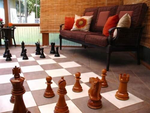 Giant teak chess set photo