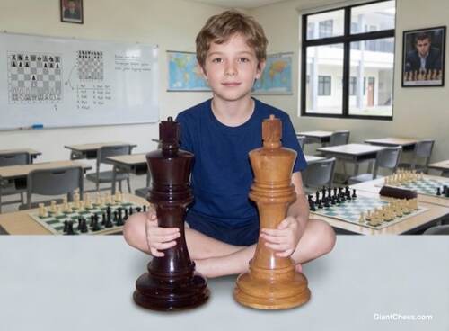 Giant teak chess set photo