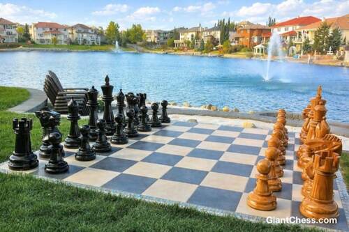 Giant teak chess set photo