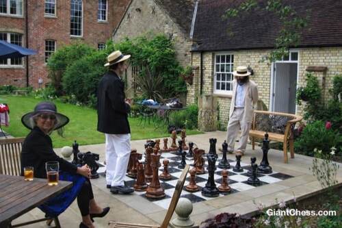 Giant teak chess set photo