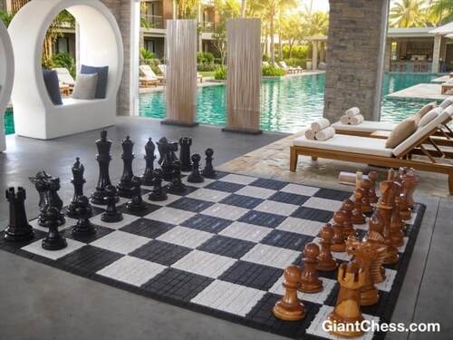 Giant teak chess set photo