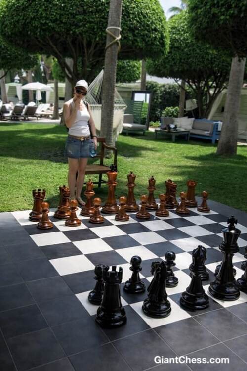 Giant teak chess set photo