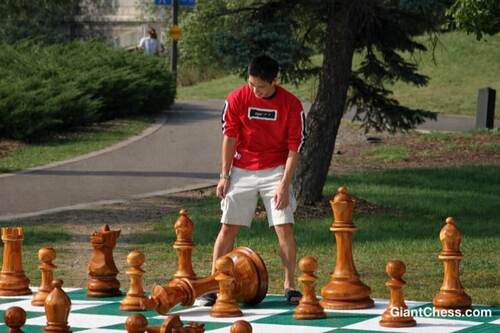 Giant teak chess set photo