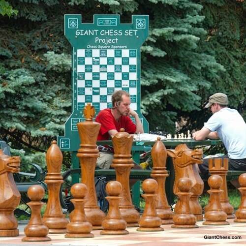 Giant teak chess set photo