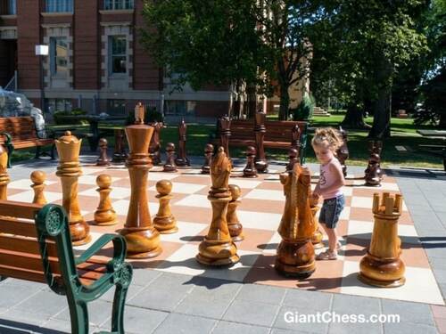 Giant teak chess set photo