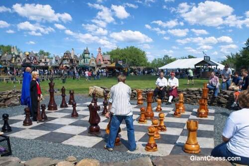 Giant teak chess set photo