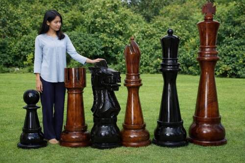 Giant teak chess set photo