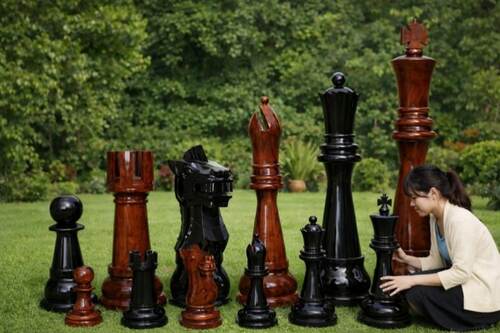 Giant teak chess set photo