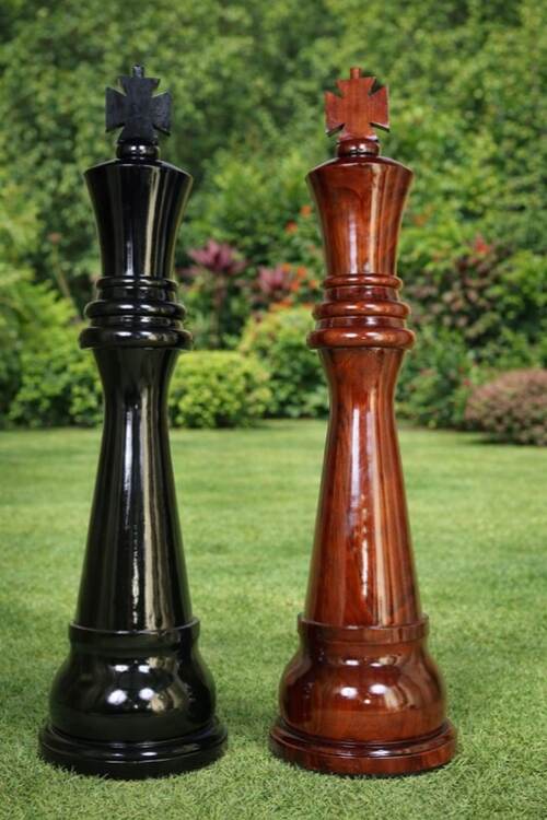 Giant teak chess set photo