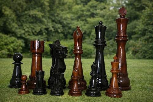 Giant teak chess set photo