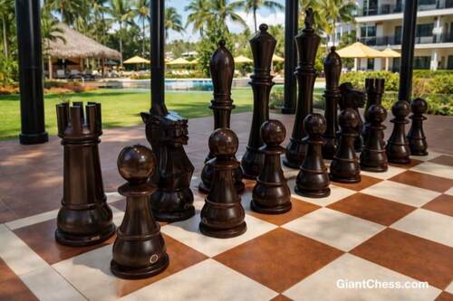 Giant teak chess set photo