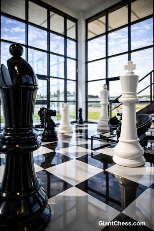 Giant teak chess set photo